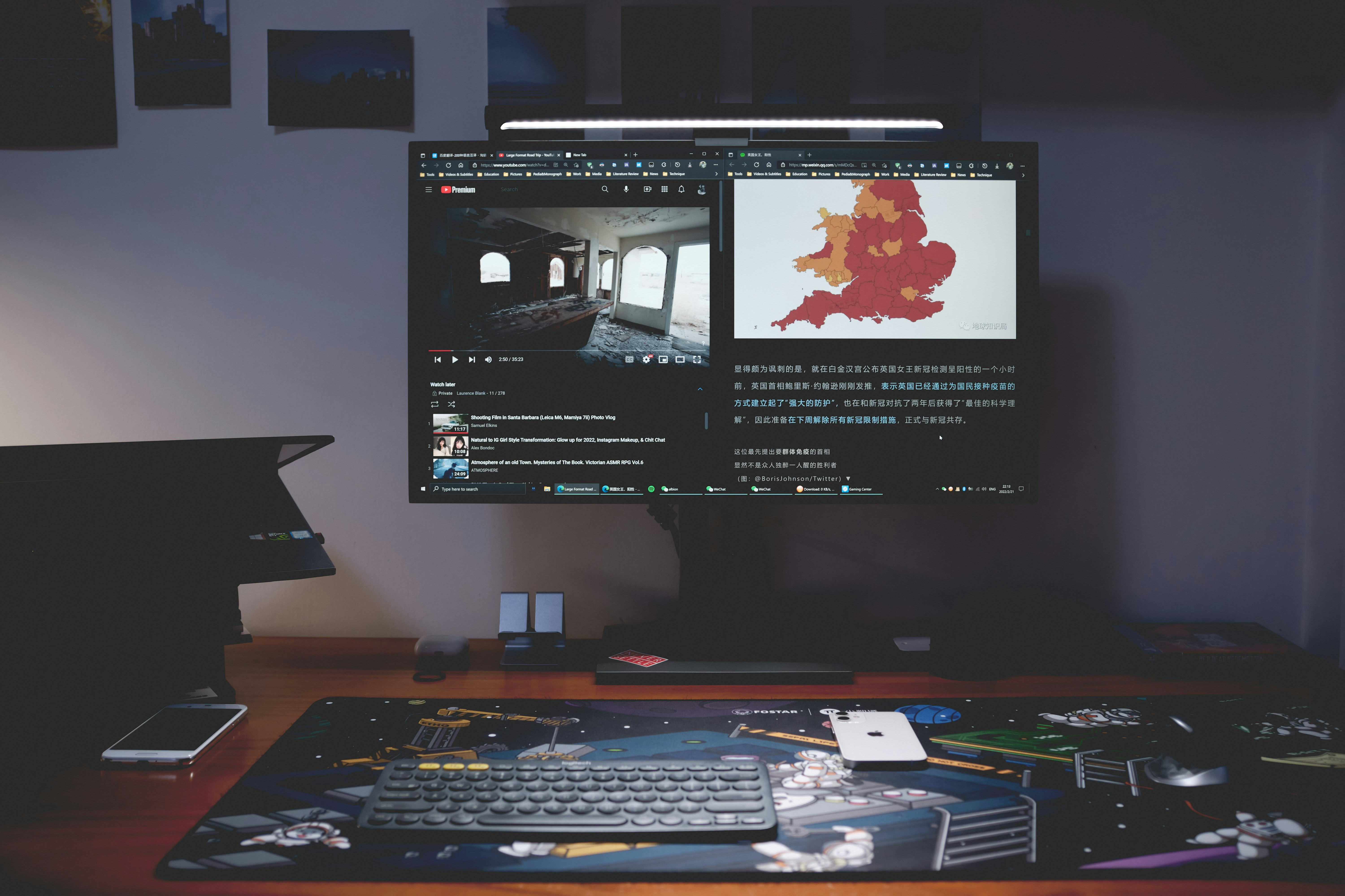 a computer monitor sitting on top of a wooden desk